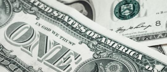 Stack of dollar bills Speeding Fines In the U.S. - The Worst Places To Go Over The Limit In America