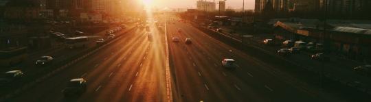 Multi-lane road at sunset Speeding Fines In the U.S. - The Worst Places To Go Over The Limit In America